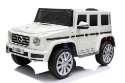 Auto elettrica a spinta Mercedes G500 12V, bianca, telecomando 2,4 GHz, ingresso USB / SD, sospensione posteriore, batteria al litio, luci LED, licenza ORIGINALE