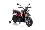 Moto elettrica APRILIA DORSODURO 900, con licenza, batteria 12V, ruote morbide EVA, 2 motori da 18W, sospensioni, telaio in metallo, forcella in metallo, ruote ausiliarie, rosso